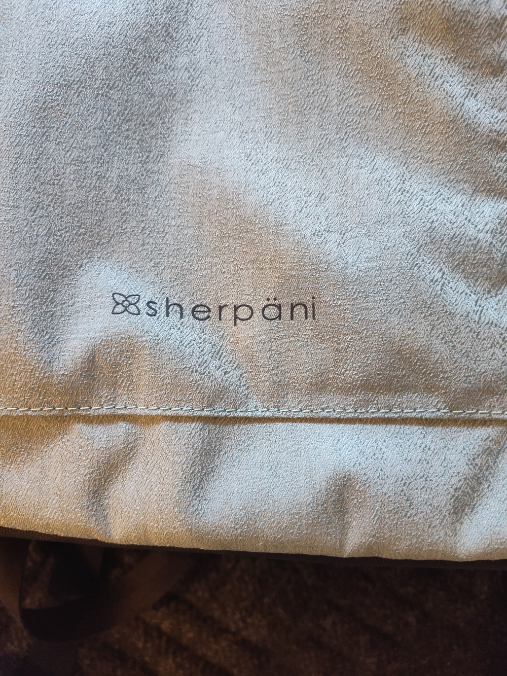 Sherpani light gray backpack dust cover